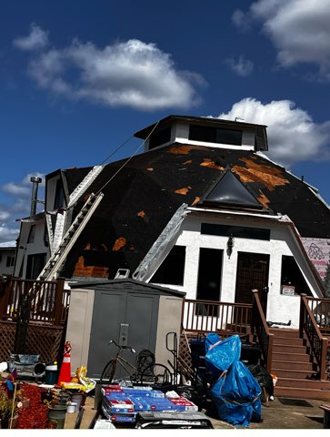 Residential roof during removal and deck preparation